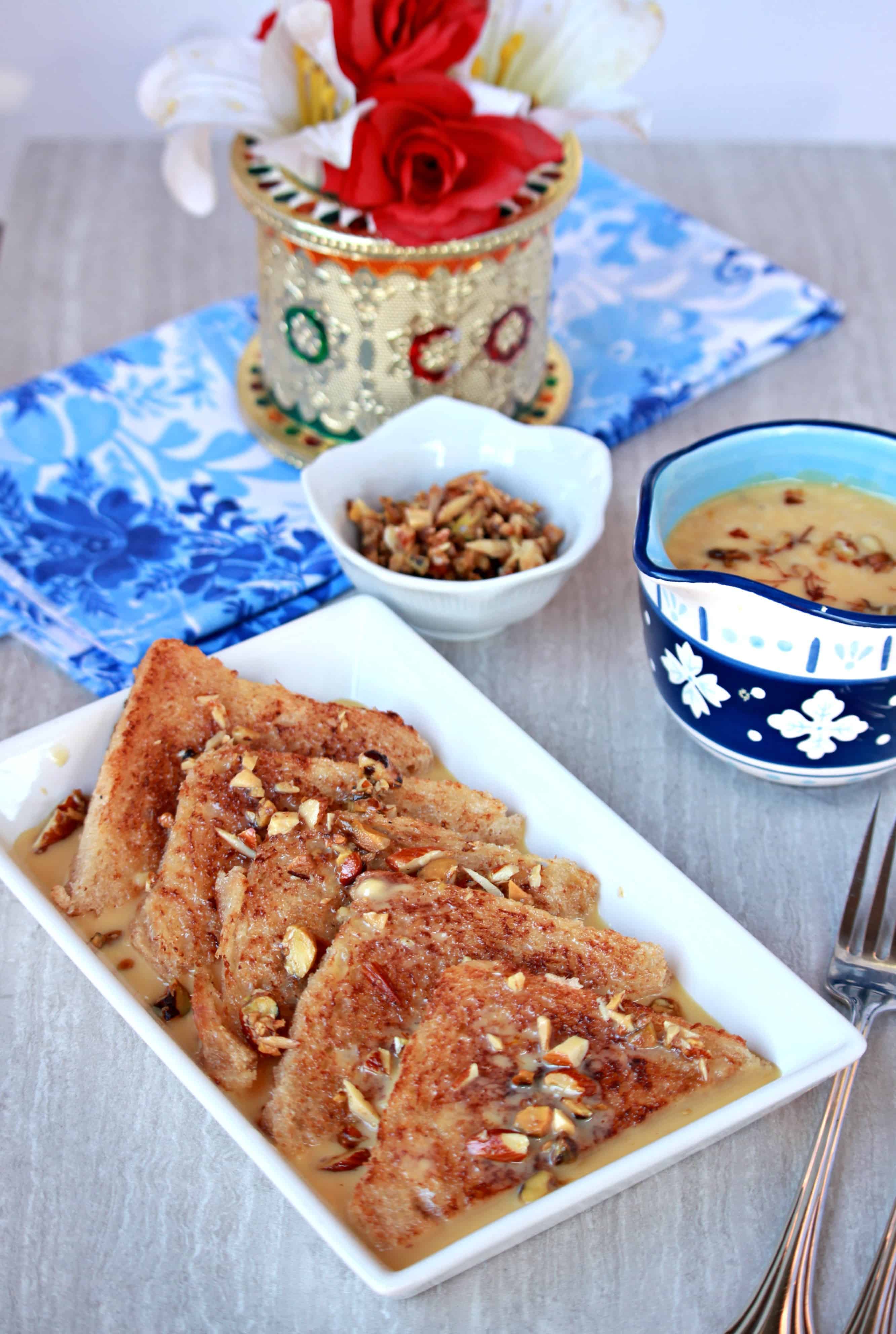 Double Ka Meetha Double Ka Meetha in a white plate with nuts and milk mixture on the side