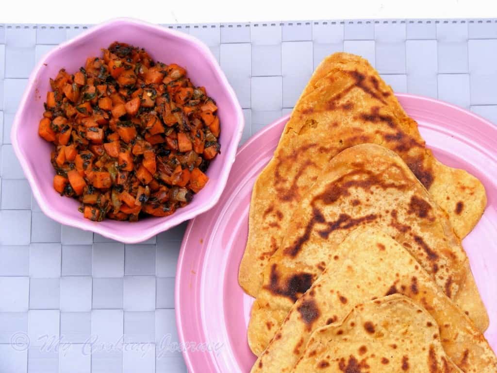 Haryana Besan Masala roti with Gajar methi subzi in a plate with bowl