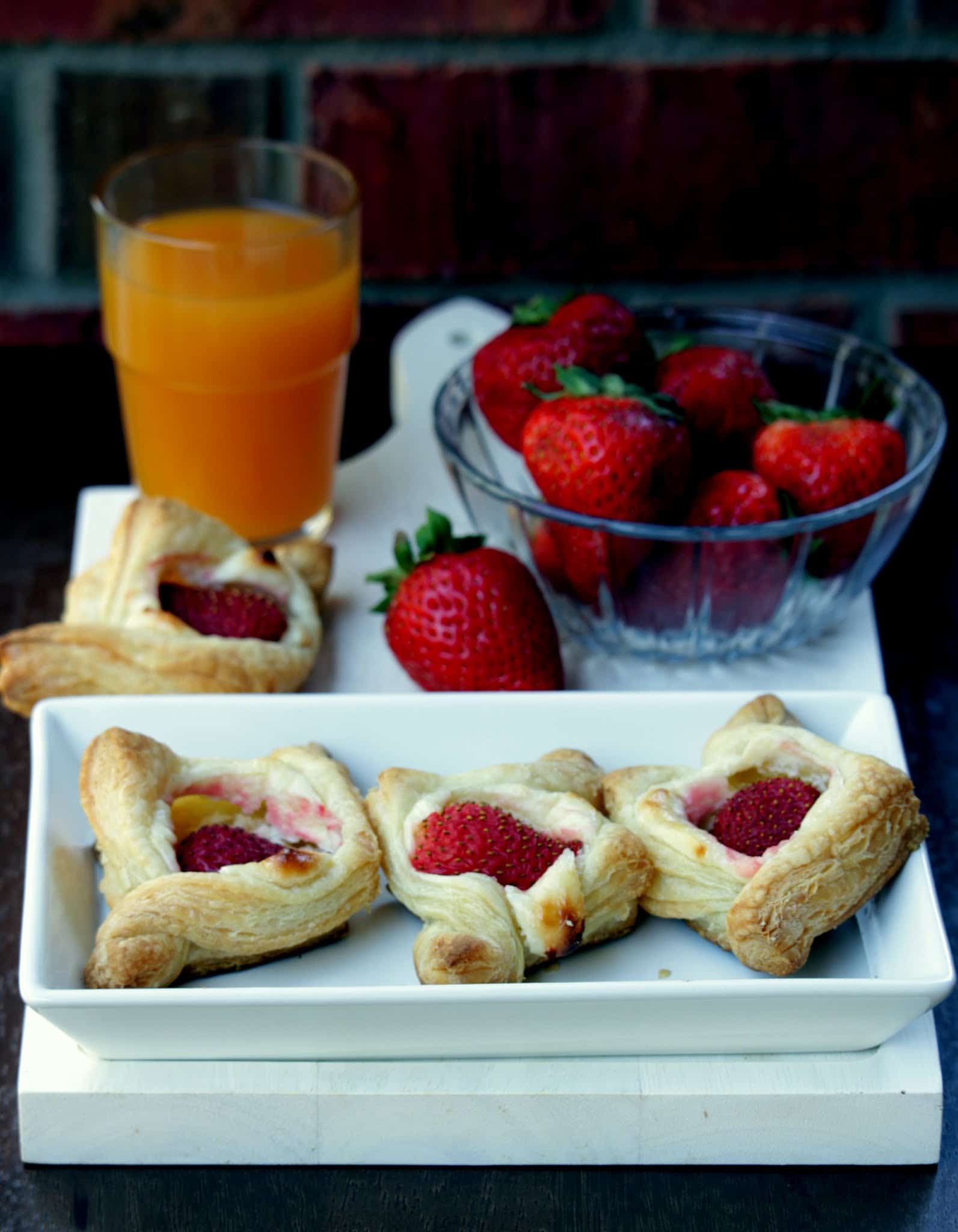 Strawberry Cream Cheese Pastry with juice and fresh strawberries in the background